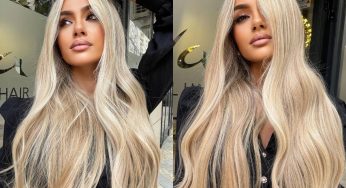 Balayage biondo platino su capelli lunghi e mossi